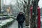 male tourist standing on footpath on middle Huaihai road, Shanghai