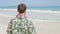 Male Tourist Standing On Hawaiian Beach