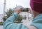 A male tourist takes a photo of the Fatih Mosque in Istanbul, Turkey as a keepsake.