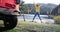 Male tourist traveler joyful jumping near a mountain lake