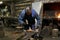 Male traditional blacksmith at work