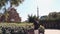 Male traveler is admiring architecture of amazing buildings in Park Guell