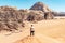 Male traveler overlooking the mountains of Wadi Rum