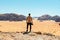 Male traveler overlooking the Wadi Rum desert in Jordan.