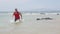 Male triathlete swimmer running out of ocean finishing swim - Triathlon swimming