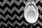 Male Urinal in White Porcelain Herringbone Tiles