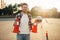 Male vehicle instructor holds cones in hands