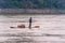 Male vendor stands on flimsy raft on Li River in Guilin, China