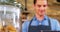 Male waiter using digital tablet at counter