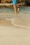 Male walking on the beach shore