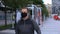 Male walking wearing mask on pavement