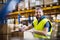 Male warehouse worker sealing cardboard boxes.