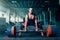 Male weightlifter prepares to pull heavy barbell