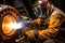 A male welder makes welding of metal parts.