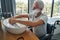 Male wheelchair user washing hands after applying shaving cream