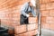 Male worker, bricklayer. Professional worker building house