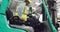 Male worker driving forklift in a warehouse