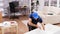 Male worker mounting a shelf on new furniture