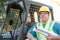 Male Worker With Technical Blueprints at Construction Site