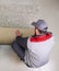 Male Worker Unrolling Carpet On Floor At Home, view from above