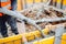 male workers pouring concrete with concrete hose. Details of construction site and close up details of worker workwear