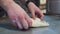 Male working with dough close up. Chef preparing khachapuri Georgian cheese pie with egg. Tasty dish making in cafe