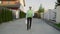 Male workman in hard hat carrying toolbox after doing repair work in the house