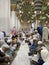 Male worshipers sit in a row waiting to break their fast inside the Prophet\\\'s Mosque