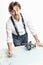 Male yachtsman measures the distance with instruments on a sea chart. White background. Vertical