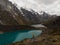 Male yellow jacket hiker Cordillera Huayhuash Circuit andes mountain Mirador Tres Lagunas three lakes view Huanuco Peru