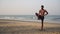 Male yogi. A man practices yoga. Asian man doing yoga asanas on the beach