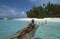 Maledives: people putting sand bags along the beach to protect it from erosion due to the global climate change