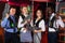 males and females in business suits posing at laser tag room