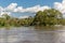 Males fishing from a traditional boat on the Amazon River in Brazil, South America