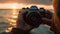 Males holding Canon lens, focus on foreground, photographing nature outdoors generated by AI