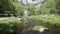 Malham Cove stream at the bottom of the rocks Yorkshire Dales National Park UK popular visitor attraction