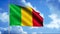 Mali flag waving in the wind, seamless loop. Motion. Yellow, red, and green national rippling flag on realistic sky