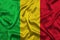 Mali national flag background with fabric texture. Flag of Mali waving in the wind. 3D illustration