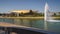 Mall of the Emirates metro station in Dubai with a small lake and fountain in front