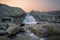 A mall waterfall in a beautiful reddish sky