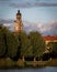 MalmÃ¶, Sweden - October 5, 2019: The church of St. Johannes is peeking up behind the trees in the park Pildammsparken during a