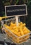 MALNUTRITION text on Blackboard label Shopping trolley cart Filled With Pasta on agriculture background. Food and