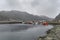 Maloy, Norway - 22nd March 2011: Small Boats, including a Ship`s Lifeboat moored in a small stone man made harbour near Maloy Town