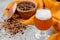 Malt grain and a glass of beer. Mixed varieties of malted grain on a gray background. close-up