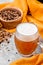 Malt grain and a glass of beer. Mixed varieties of malted grain on a gray background. close-up