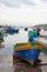 Malta august 2015 Marsaxalok lonely woman on the dock