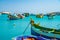 Malta. Beautiful view on the traditional eyed colorful boats Luzzu in the Harbor of Mediterranean fishing village Marsaxlokk, Malt