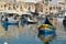 Malta colorful painted fishing boat in marsaxlokk village