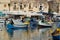 Malta colorful painted fishing boat in marsaxlokk village