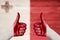 Malta flag painted on female hands thumbs up